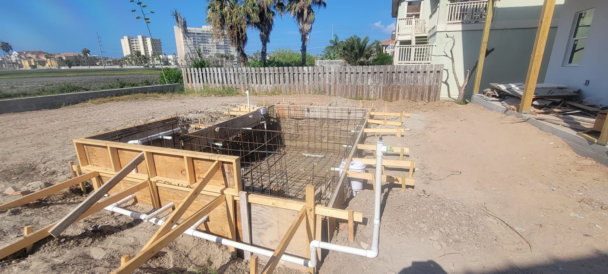 Rebar structure and plumbing installed before the concrete pour