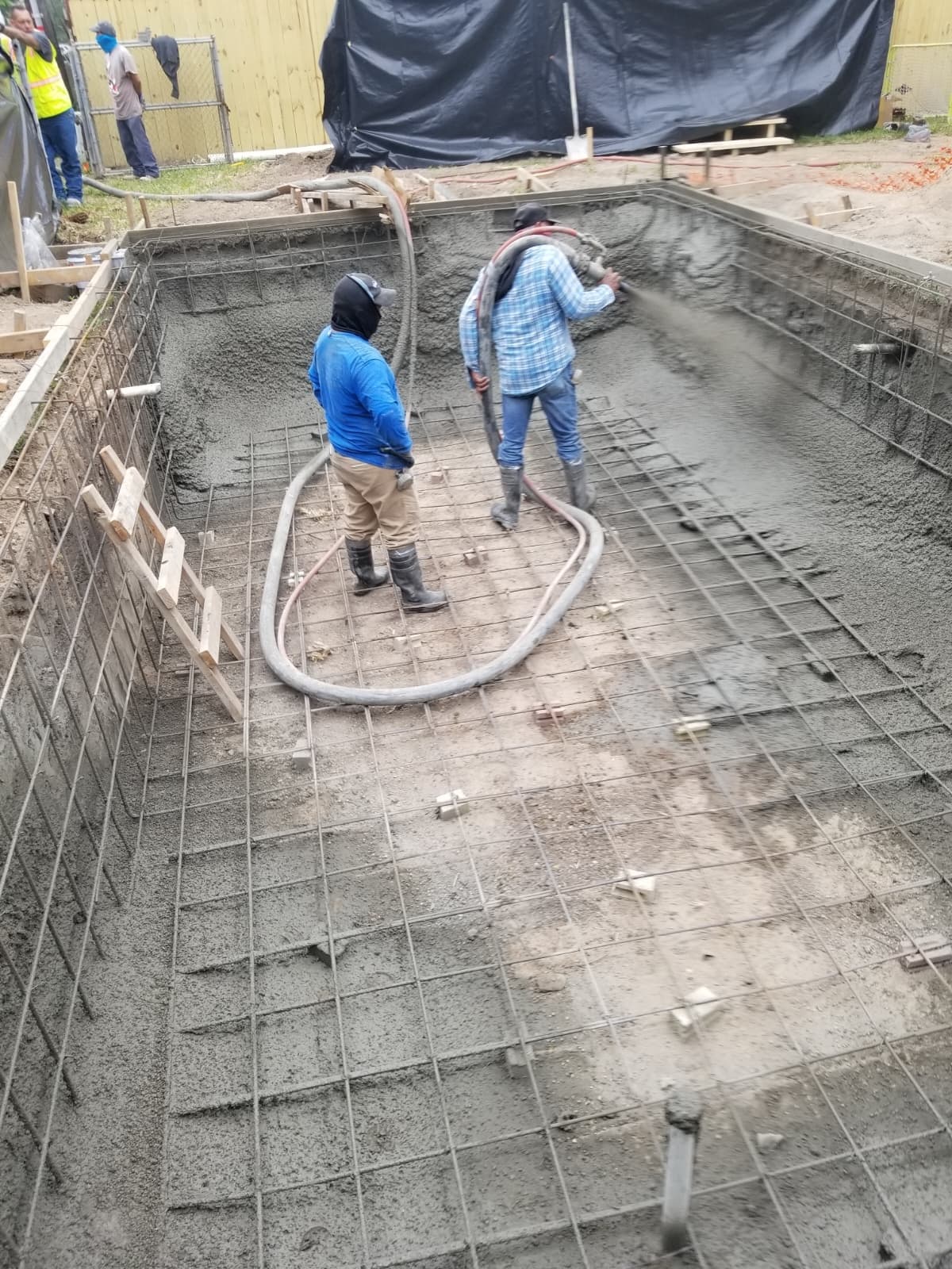 Freshly plastered pool shell with steps, ready for water