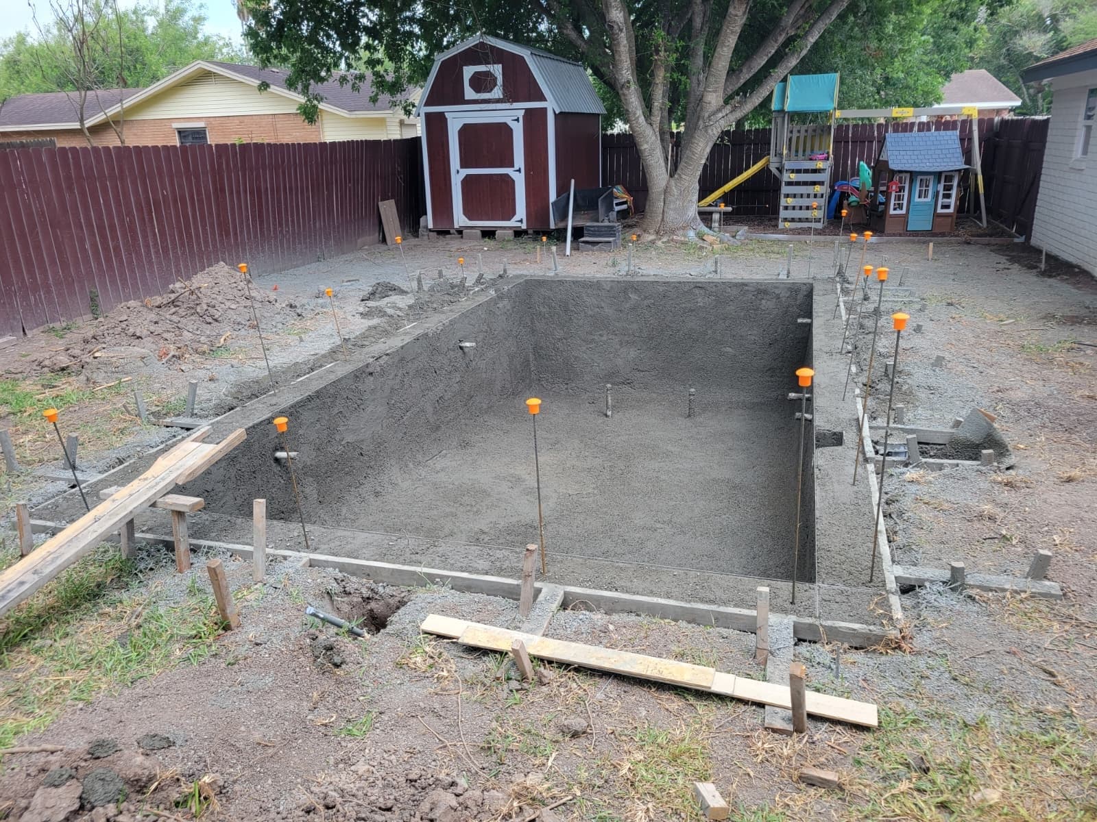 Freshly plastered pool shell with steps, ready for water