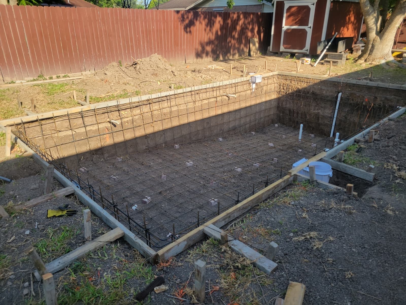 Rebar structure and plumbing installed before the concrete pour